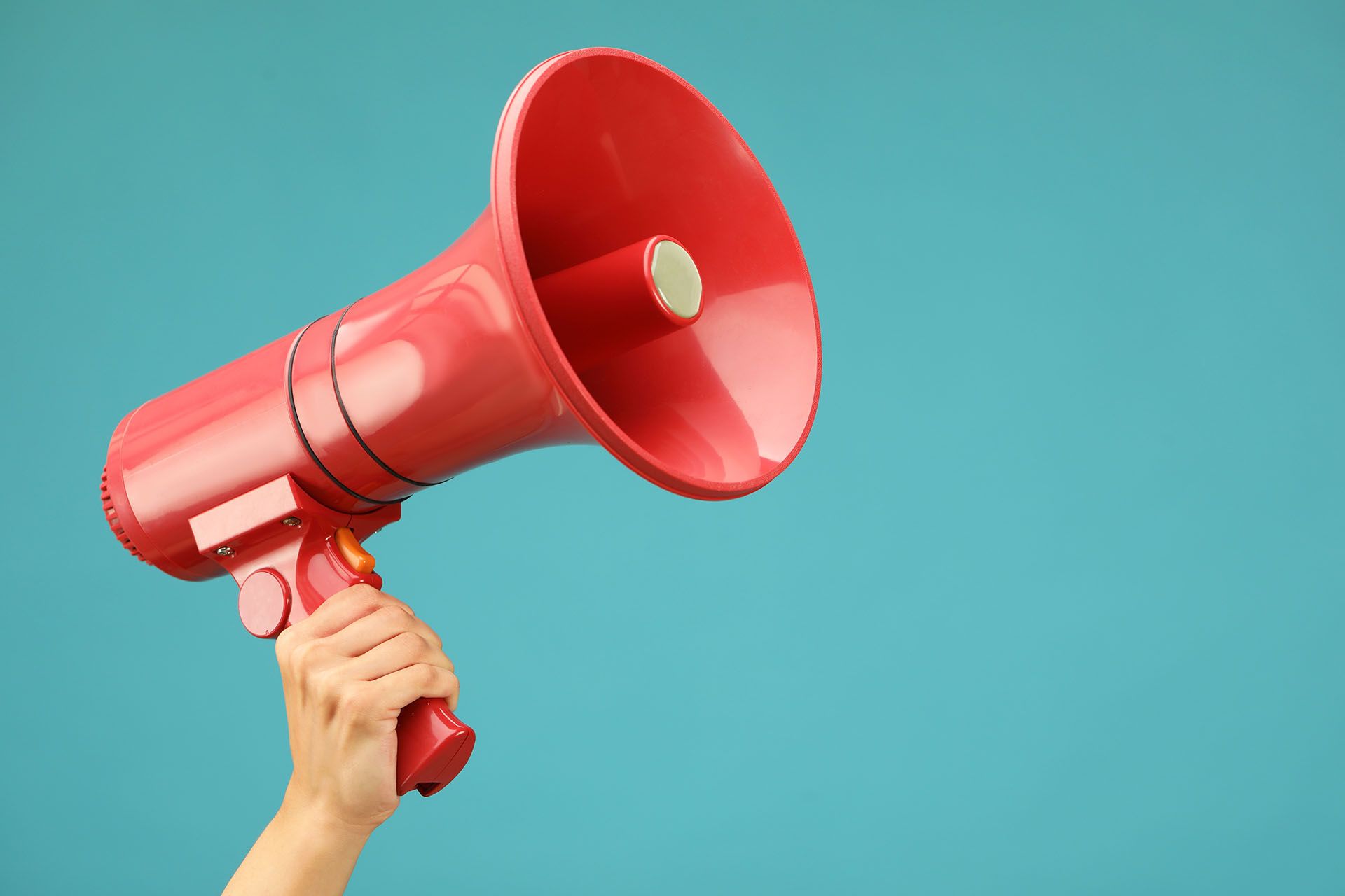 Woman,Holding,Megaphone,Speaker,On,Blue,Background,,Closeup.,Space,For